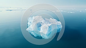 Simplistic image of solitary iceberg adrift in blue ocean