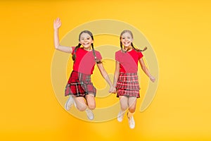 Simply being around. english style fashion. happy little girls in checkered skirt. beauty look. happy children