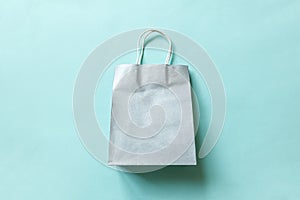 Simply minimal design shopping bag isolated on blue pastel background. Online or mall shopping shopaholic concept. Black friday