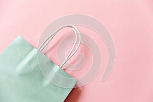 Simply minimal design shopping bag isolated on pink pastel background. Online or mall shopping shopaholic concept. Black friday