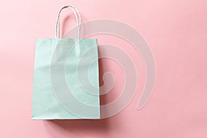 Simply minimal design shopping bag isolated on pink pastel background. Online or mall shopping shopaholic concept. Black friday