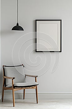 The simulation of a black frame with a white coating contrasts with the plain white wall. and simple furniture