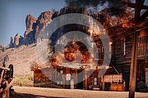 Simulation of a city fire of an old wild western wooden building in a gold mine