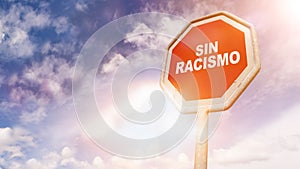 Sin racismo, Spanish text for No racism text on red traffic sign photo