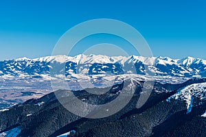 Siná a Západní Tatry z vrchu Chabenec v zimě Nízké Tatry na Slovensku