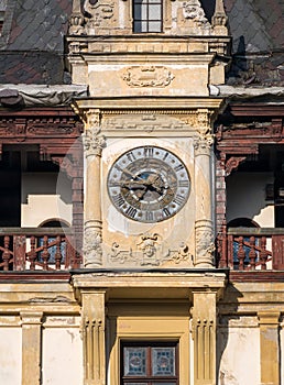 Architecture detail with one of the Peles Castle towers. Castle tower with a clock
