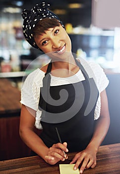 Sincere attractive young coffee shop owner