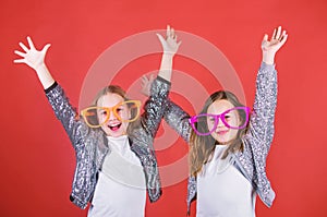 Sincere cheerful kids share happiness and love. Girls funny big eyeglasses cheerful smile. Birthday party. Happy