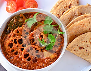 Kamal kakadi curry -lotus stem cooked in tomato gravy photo