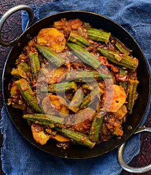 Sindhi main course - okra curry or seyal bhindi patata photo