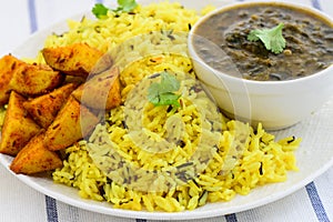 Sindhi platter- garlic rice,fried potatoes and lentils