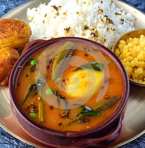 Sindhi thali meal - Kadhi chawal boondi and aloo tuk photo