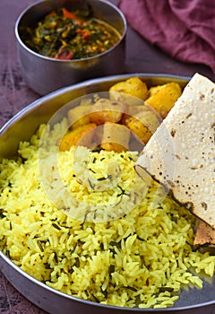 SIndhi traditional meal - lentils rice and potatoes with papad