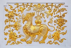 Singa in traditional Thai style molding art.