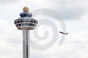 Singapore Changi Airport Traffic Controller Tower With Plane Takeoff