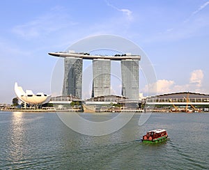 Singapore city skyline with Singapore river cruise, Marina Bay Sands, Art Science Museum view from Esplanade Bridge