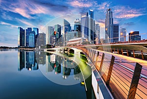 Singapore city skyline at sunset  with bridge