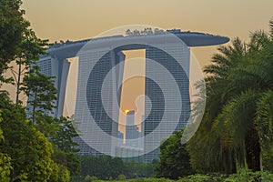 SINGAPORE, SINGAPORE - DECEMBER 16 2018: Night view at Supertree skywalk in Gardens by the Bay in SingaporeThe Beautiful sunset