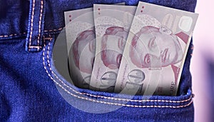 Sierra Leone 5000 Leones Banknotes in Pocket of Jeans photo