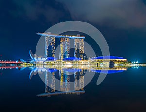 Singapore Downtown skyline at night with reflection. Financial district and business centers in technology smart urban city in