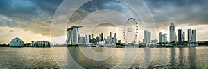 Singapore financial district skyline at Marina bay on cloudy day.