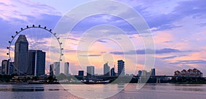 Singapore flyer and city in the sunset