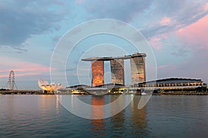 Singapore Flyer and famous hotel of Marina Bay Sands on sunset