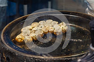 Singapore food court- delicious fried dumplings on hot pan