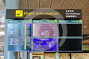 Close up of flight information digital display screen at Changi Airport