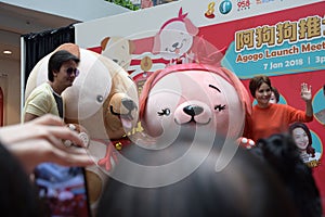 Singapore Mediacorp artistes Chen Hanwei and Zoe Tay with mascots for Lunar New Year of the dog