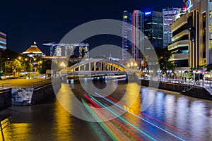 Singapore at night with light trails on the river