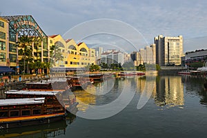 The Singapore River with with tour boats moored in front of Riverside Point on the left, and Clarke Quay on the right