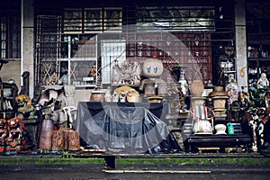 Shop front of vintage antique store that sells a treasure trove of old second hand furniture and homeware
