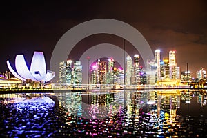 SINGAPORE, SINGAPORE - MARCH 2019: skyline of Singapore Marina Bay at night downtown core skyscrapers and the Art Science museum