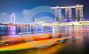 SINGAPORE, SINGAPORE - MARCH 2019: Skyline of Singapore Marina Bay at night with Marina Bay sands, Art Science museum and tourist