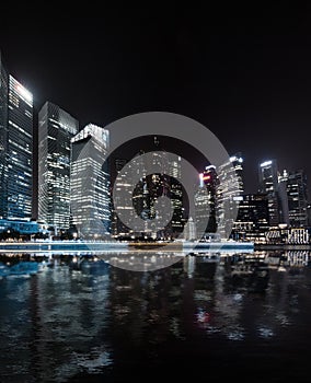 Singapore skyline night panorama. Modern urban city view