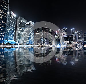 Singapore skyline night panorama. Modern urban city view