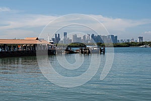 Singapore skyline seen from St. John`s Island, and offshore island south of Singapore