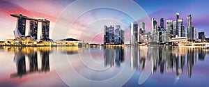 Singapore skyline at sunrise - panorama with reflection