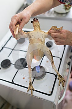 Singeing chicken on fire