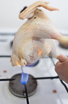 Singeing chicken on fire