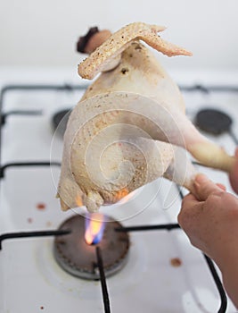 Singeing chicken on fire