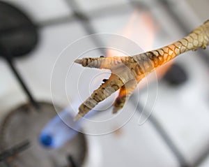 Singeing chicken on fire