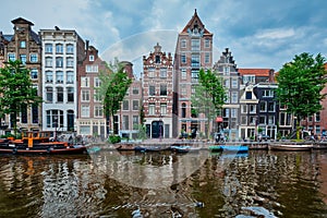 Singel canal in Amsterdam with houses. Amsterdam, Netherlands