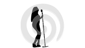 Singer dances to the beat of her song. White background. Silhouette. Side view. Slow motion