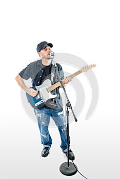 Singer Guitarist on White with hat strumming