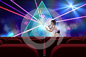 singer performing in front of 3d empty cinema