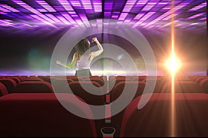 singer performing in front of 3d empty cinema