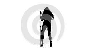 Singer performs her song of authorship. White background. Silhouette. Slow motion