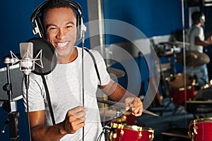 Singer recording his new track in studio photo